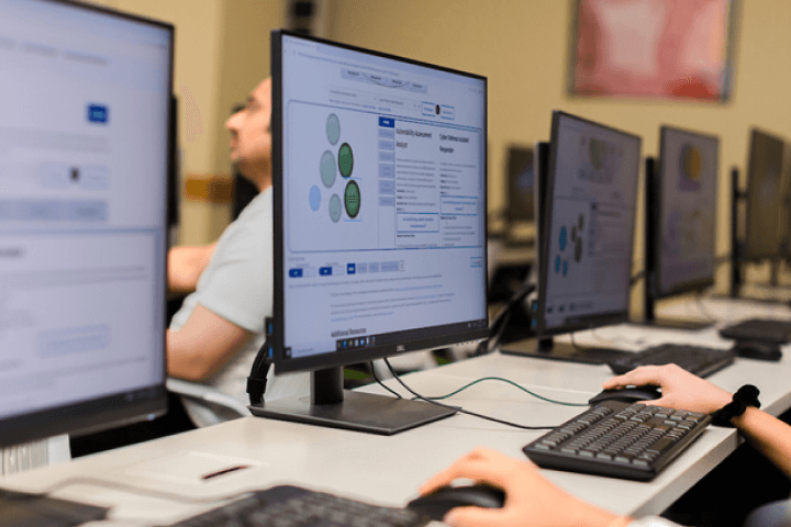 Student in front of a desktop monitor